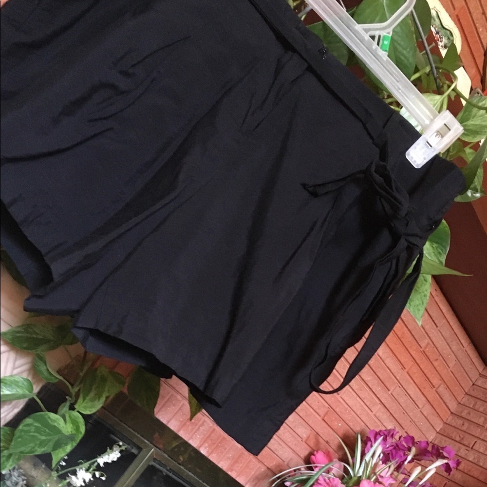 Black Rayon shorts with pockets and tie belt.